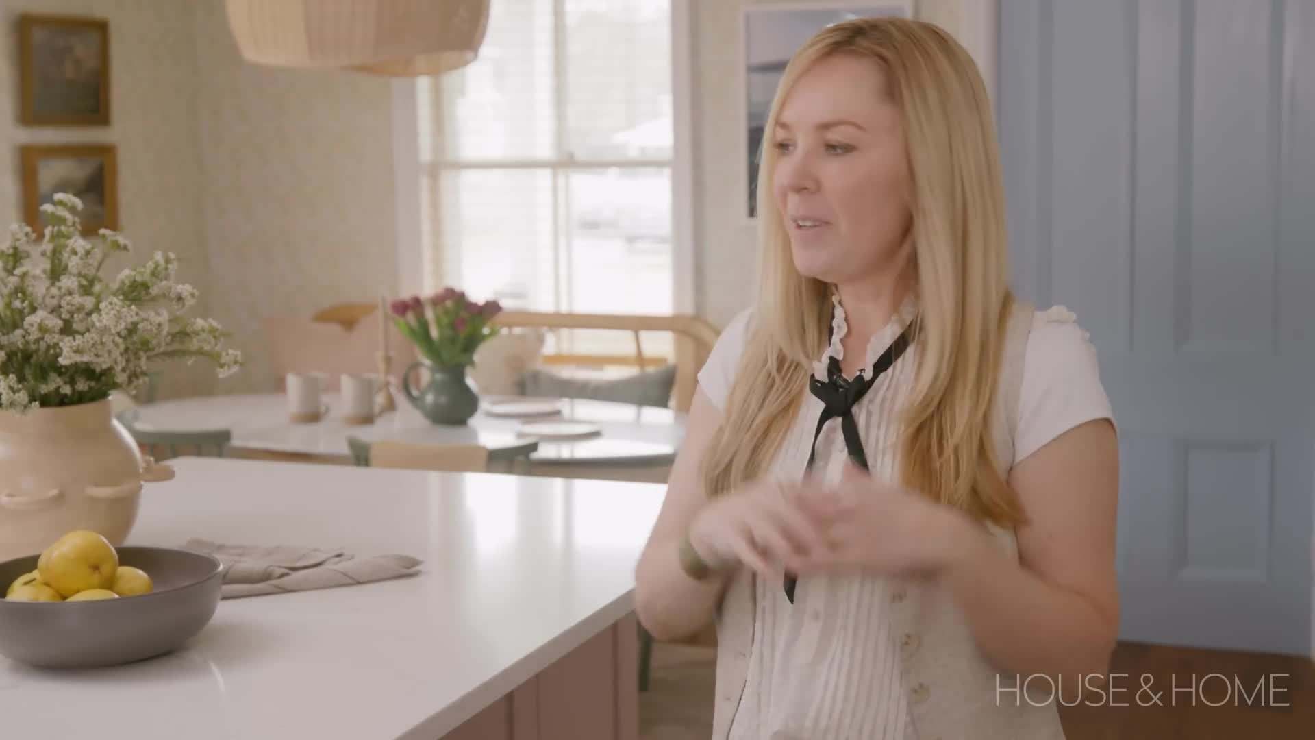 Soft pink cabinets add elegance and charm to the kitchen