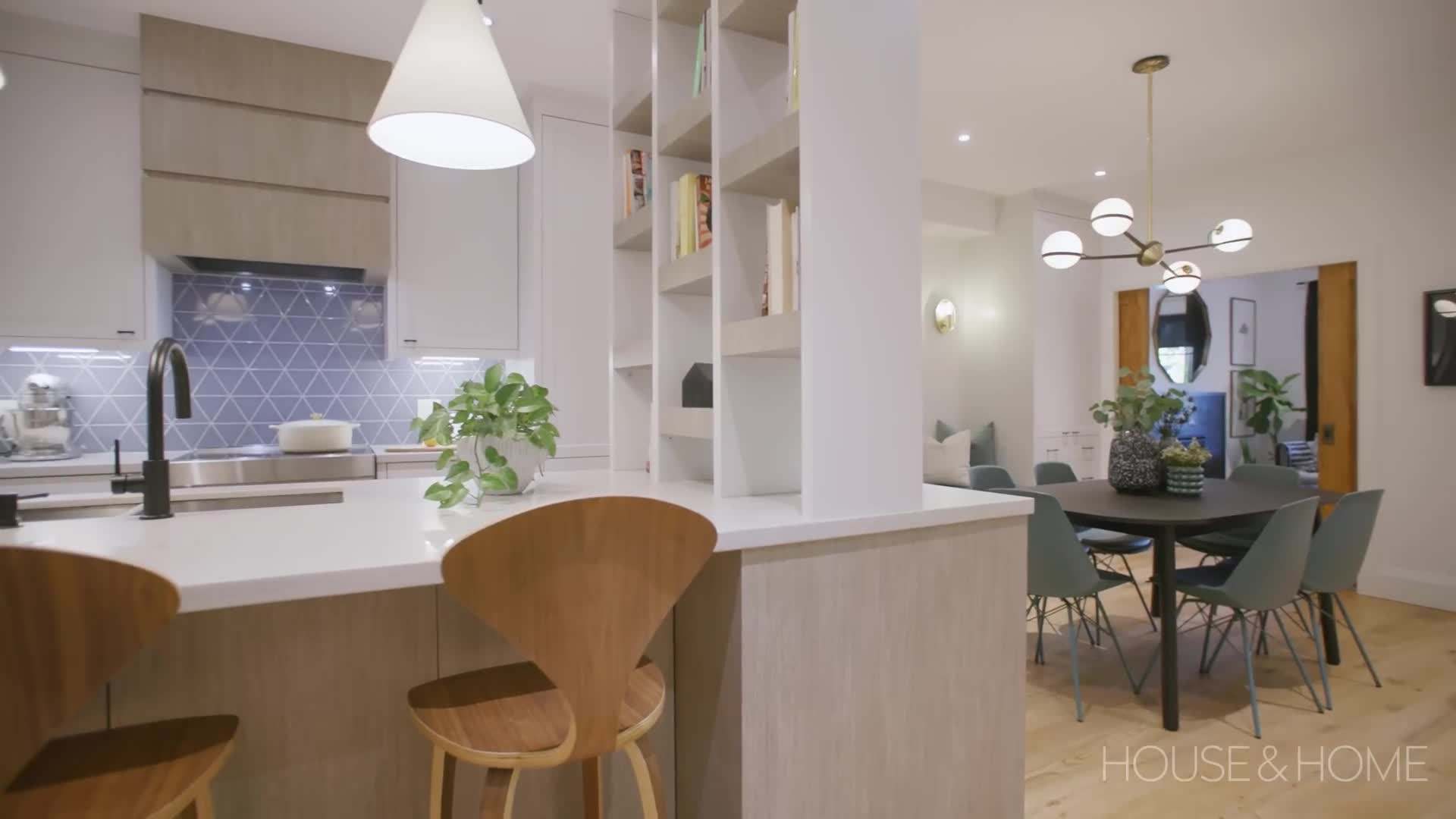 Large windows and glass doors flood the interior with natural light