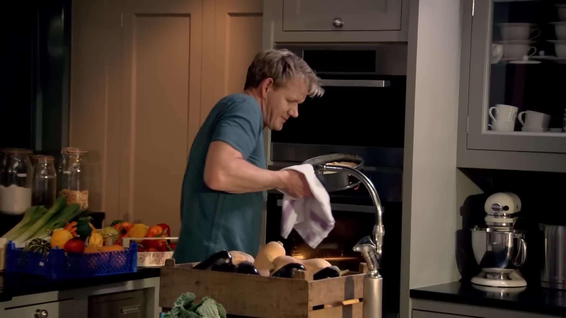 Pressing the graham cracker crust into the pan