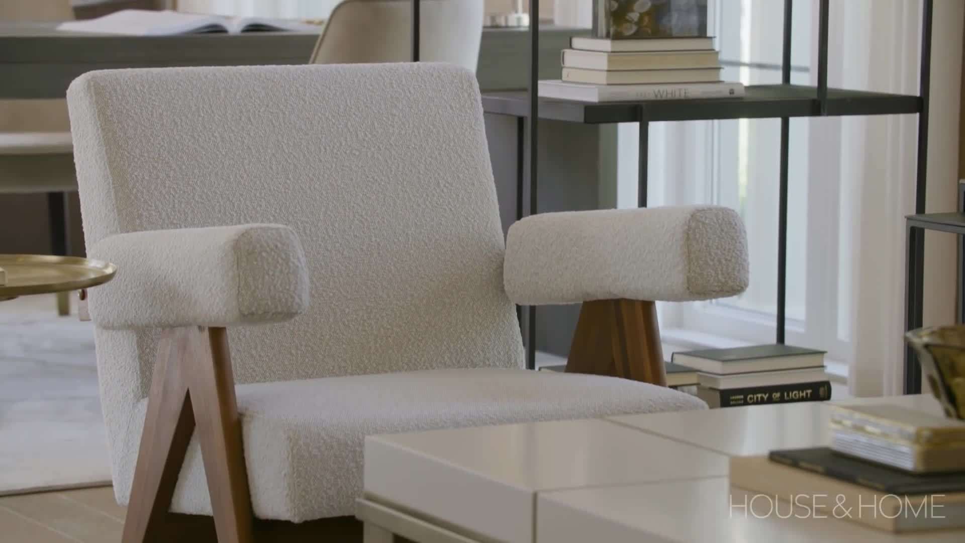 The kitchen boasts top-of-the-line appliances, custom cabinetry, and a stunning marble backsplash.