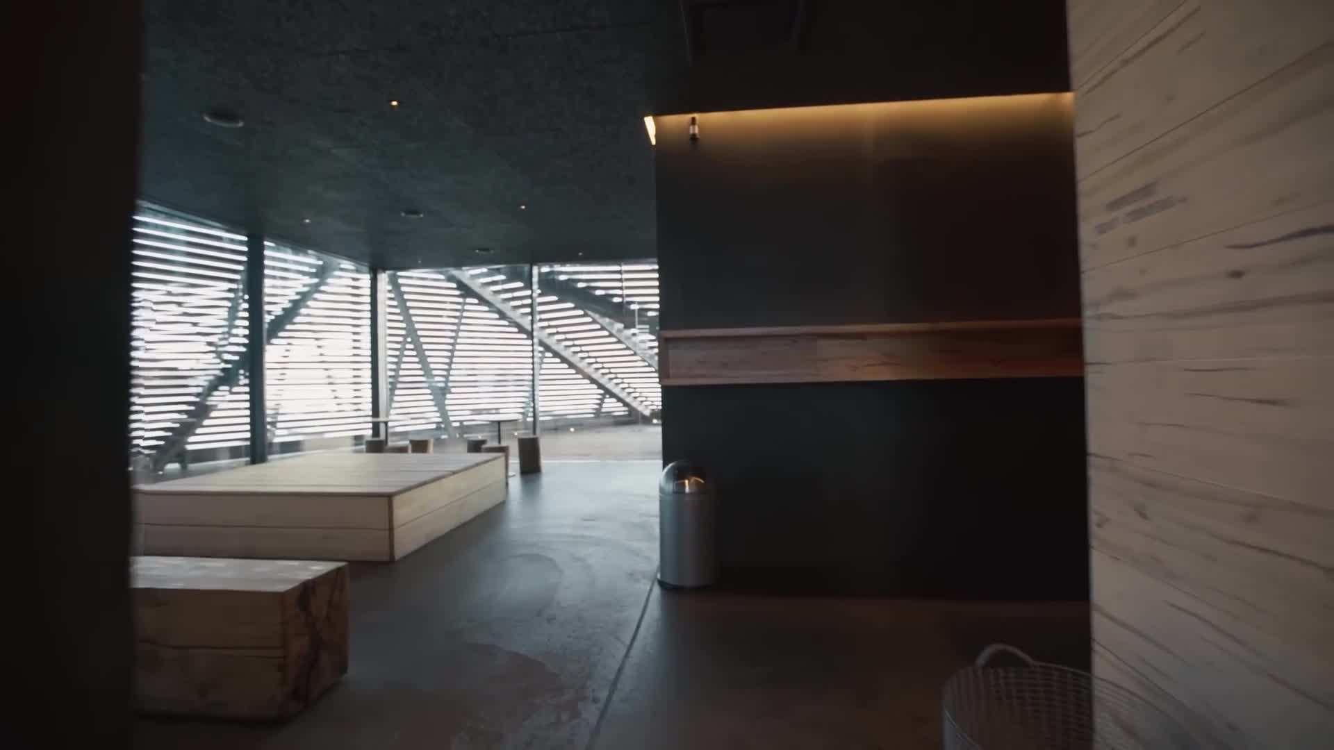 Sauna-goers cooling off in a nearby lake after a sauna session