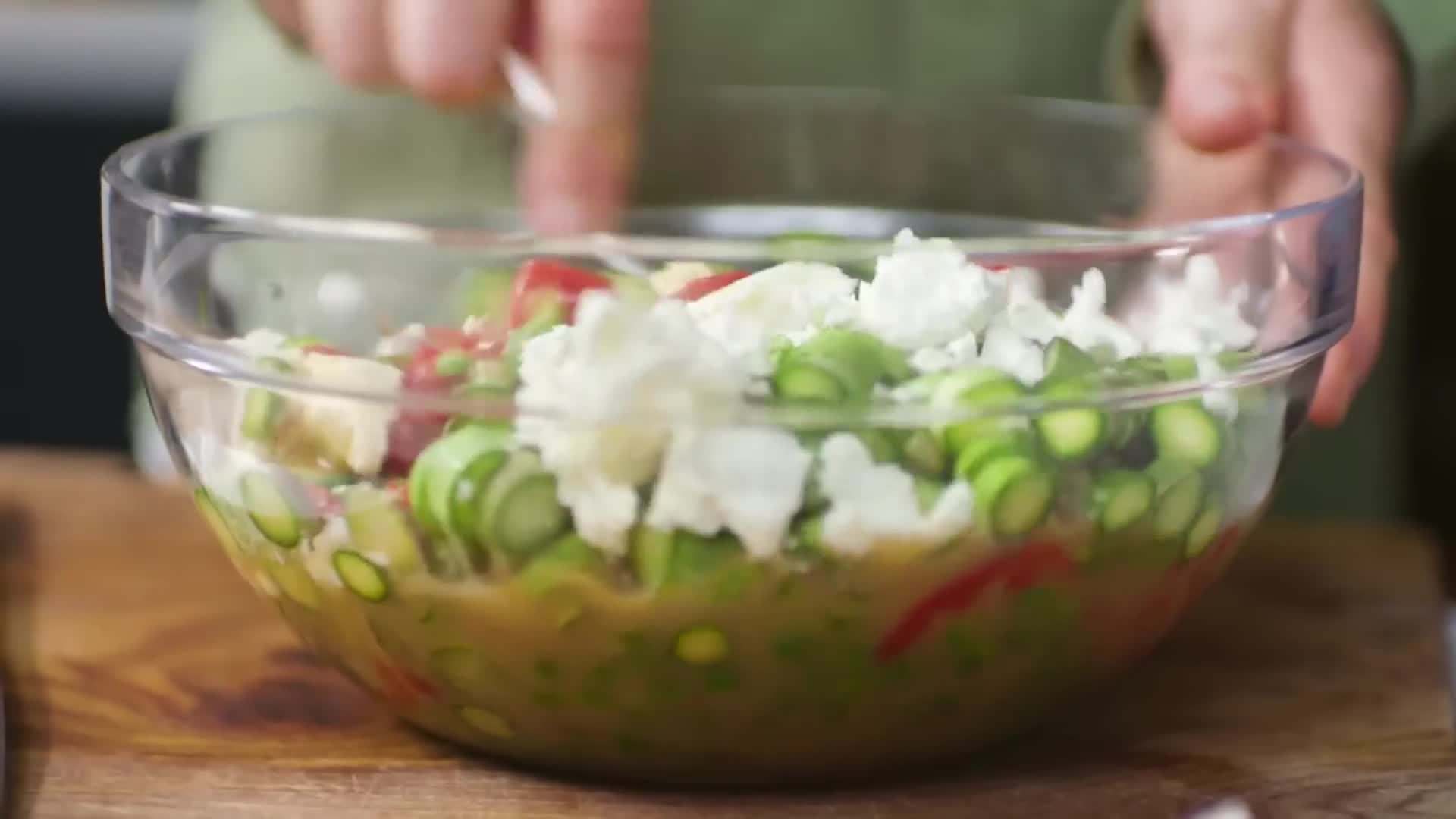 Whisking together the eggs, cream, cheese, and harissa paste