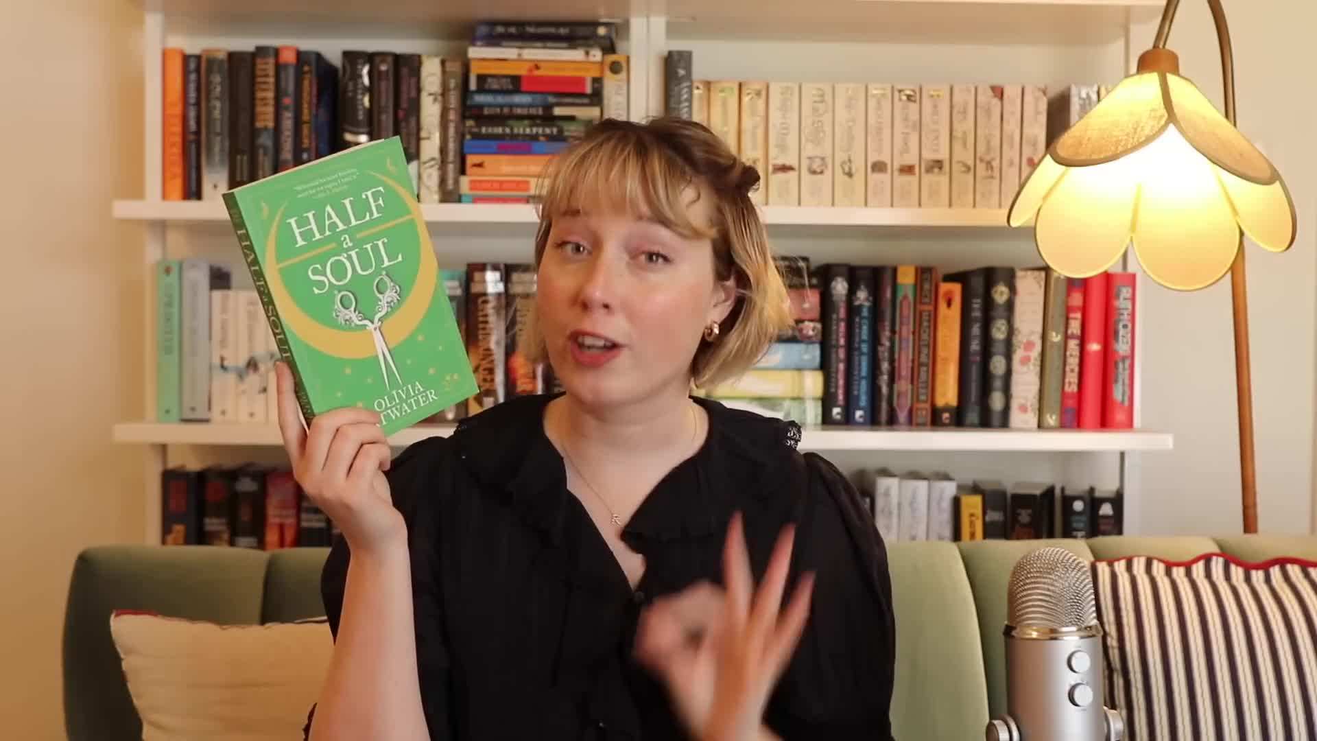 Illustration of a book with a heart-shaped flower on the cover, symbolizing the heartwarming nature of the romances