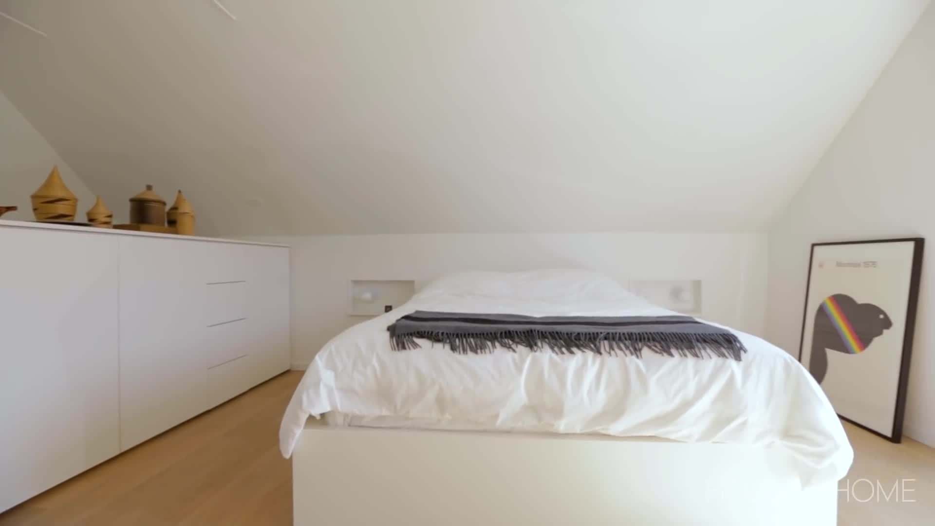 The cozy bedroom with soft lighting