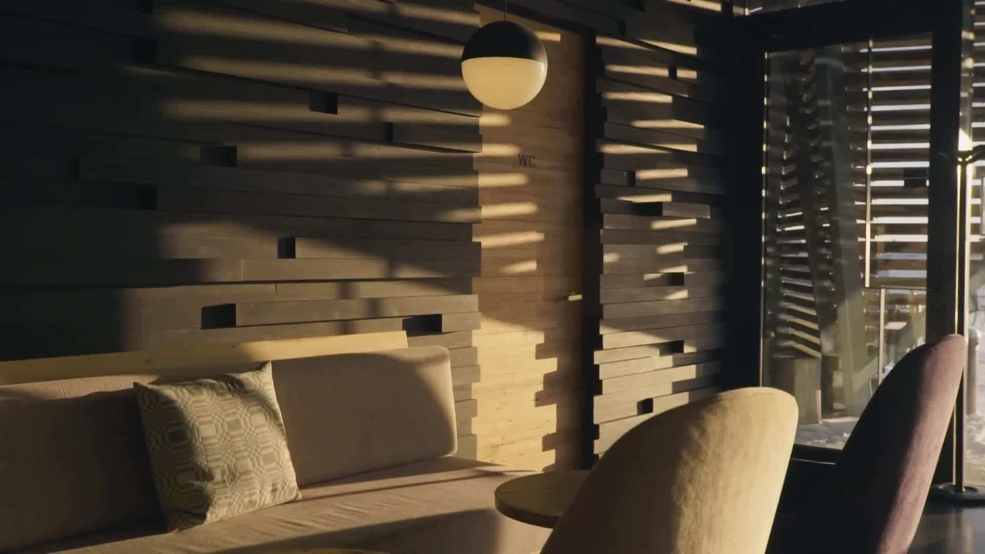 Interior view of Löyly sauna with large windows offering panoramic views