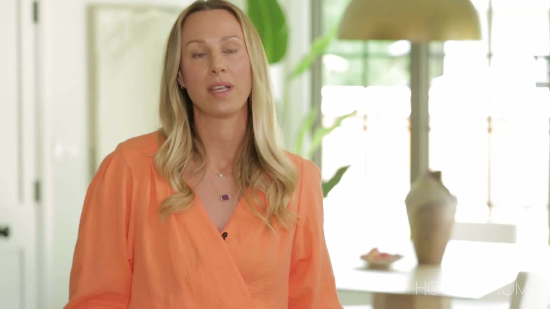 Open concept living room with large windows and minimalist furniture