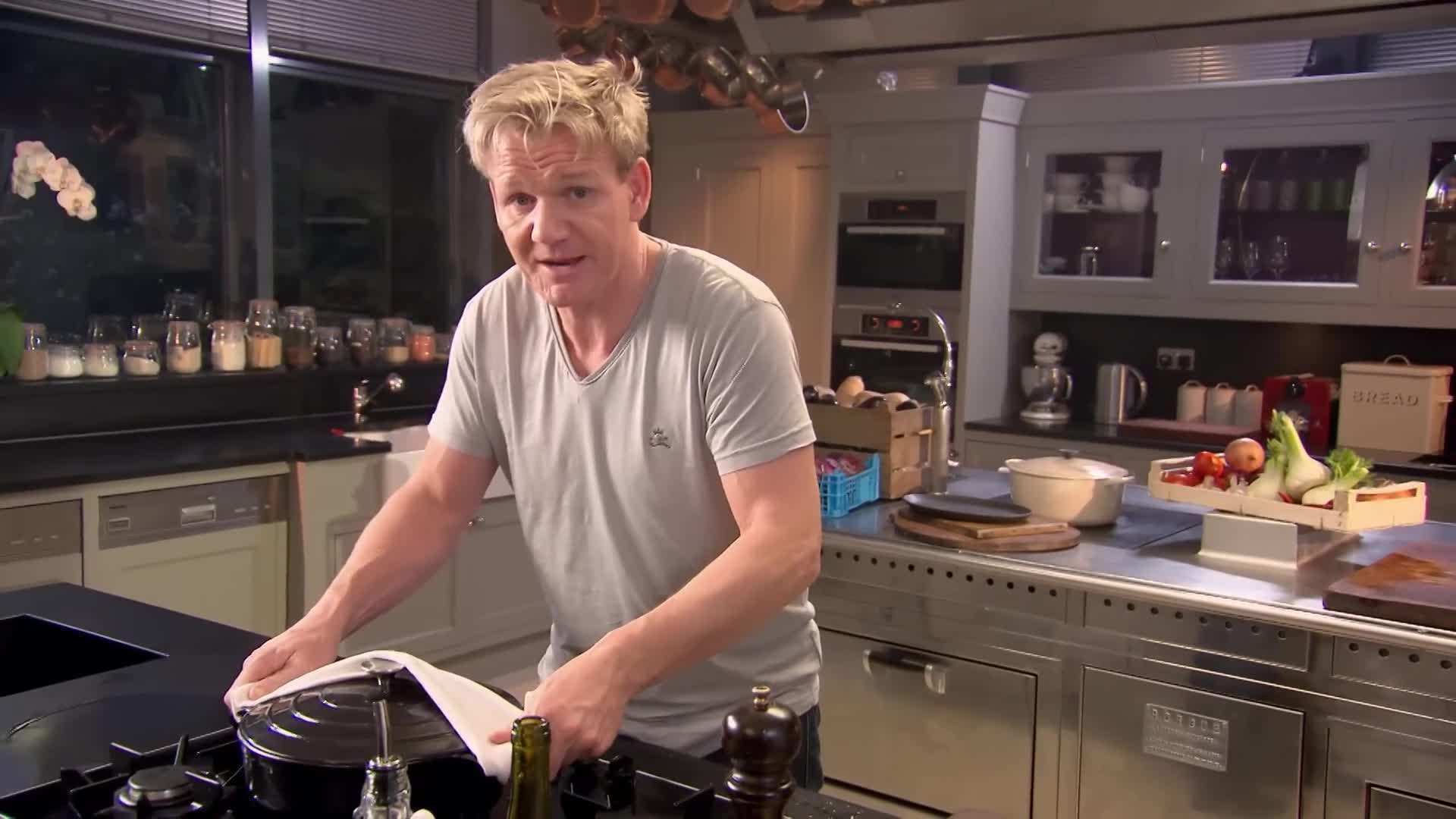 Adding red wine and broth to the pan