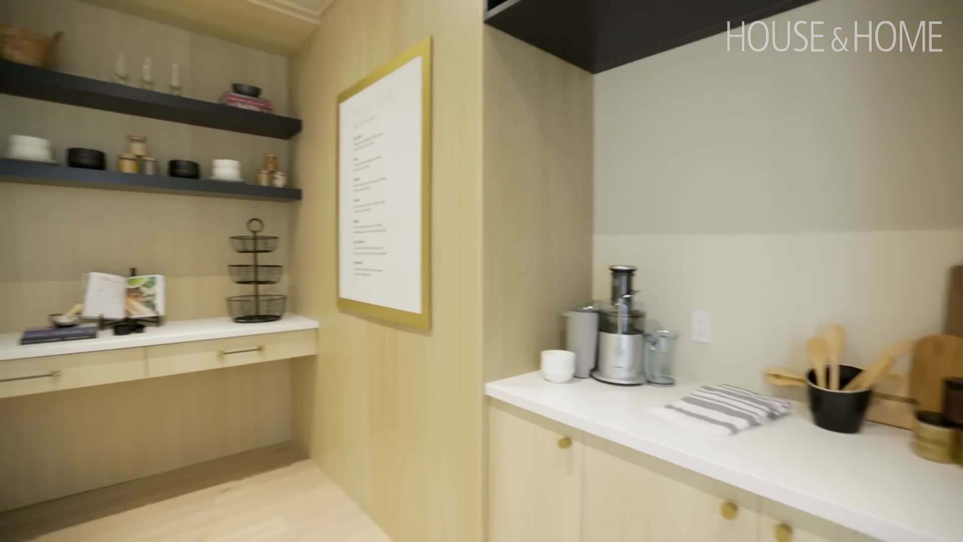The grand staircase and luxurious chandelier in the foyer
