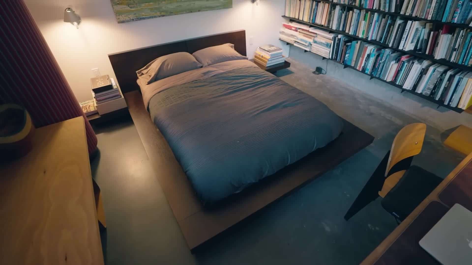 Floor-to-ceiling windows offering breathtaking views of the surrounding woods and water