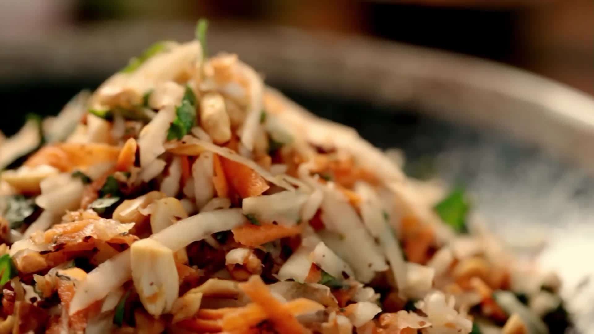A colorful Mediterranean salad with ripe tomatoes, cucumbers, red onions, Kalamata olives, and feta cheese