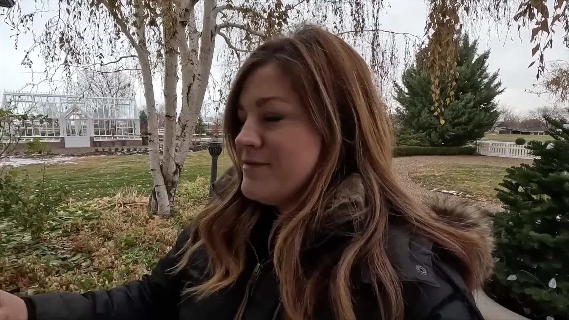 Windowbox decorated with red and gold ornaments
