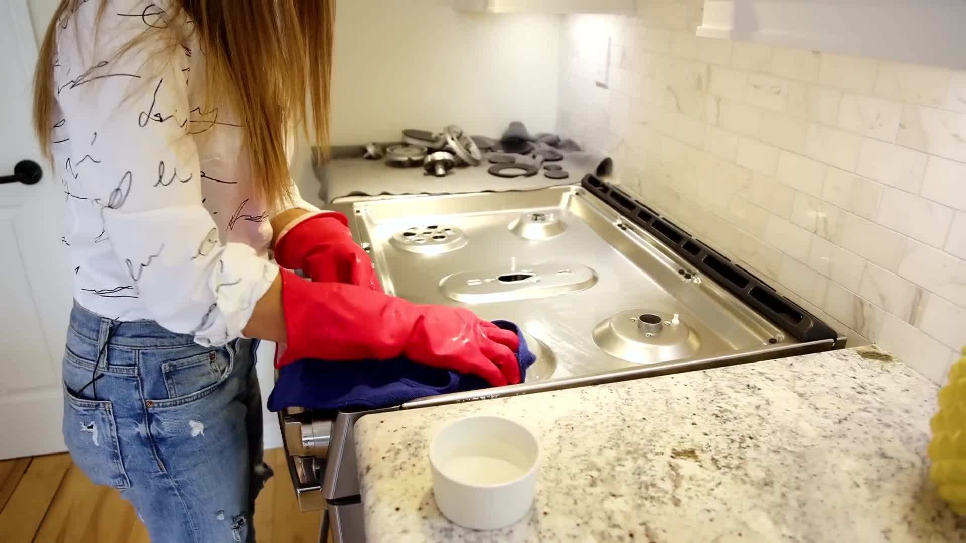 Wiping down the stove top