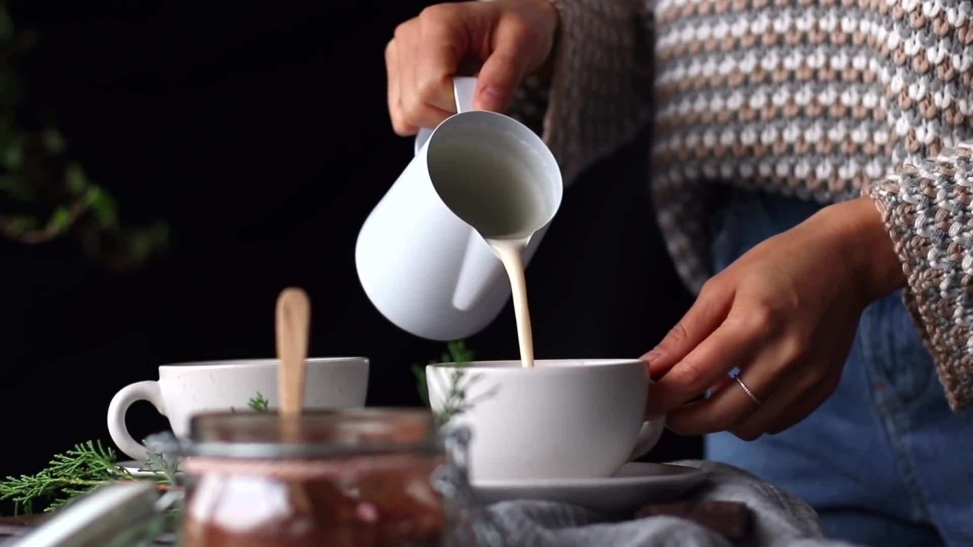 A cozy latte with a dollop of foam and a sprinkle of cinnamon on top