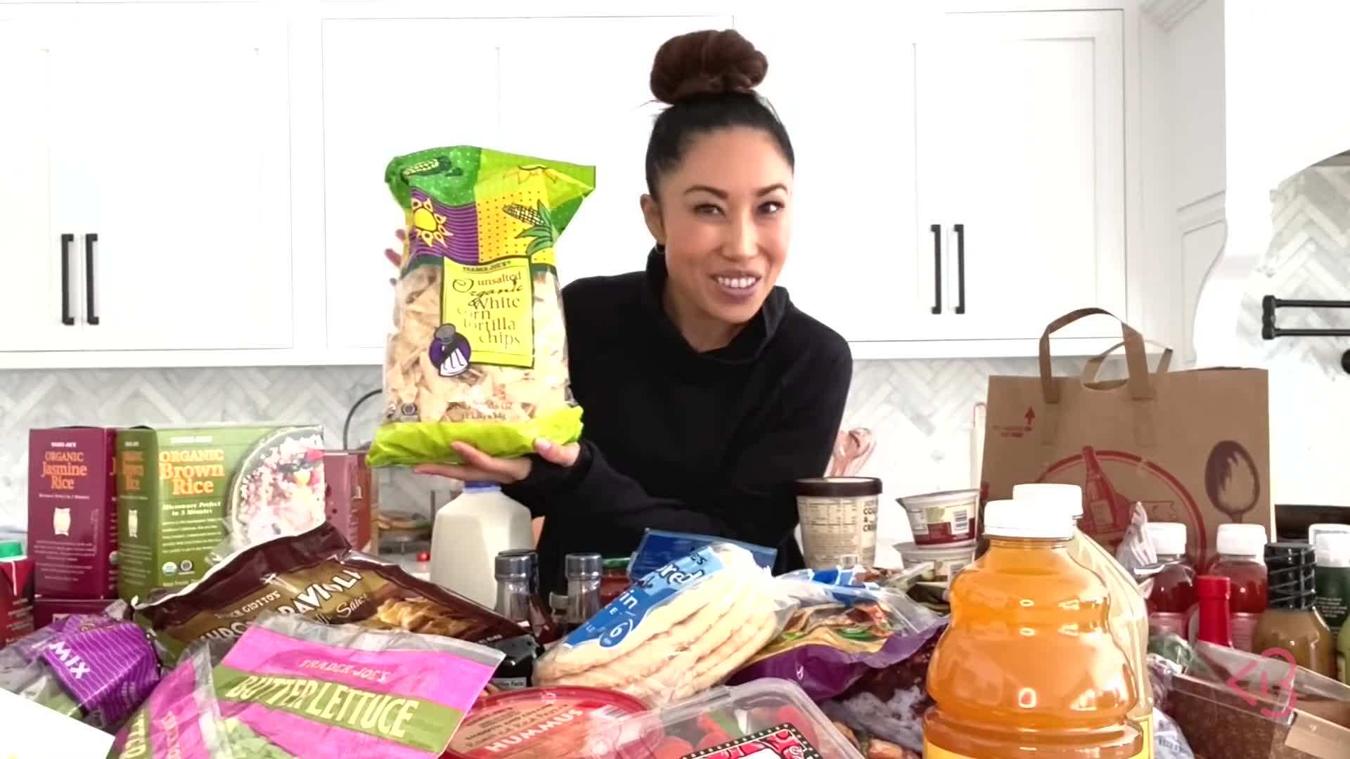 Essential snacks and treats - nuts, dried fruits, dark chocolate, popcorn