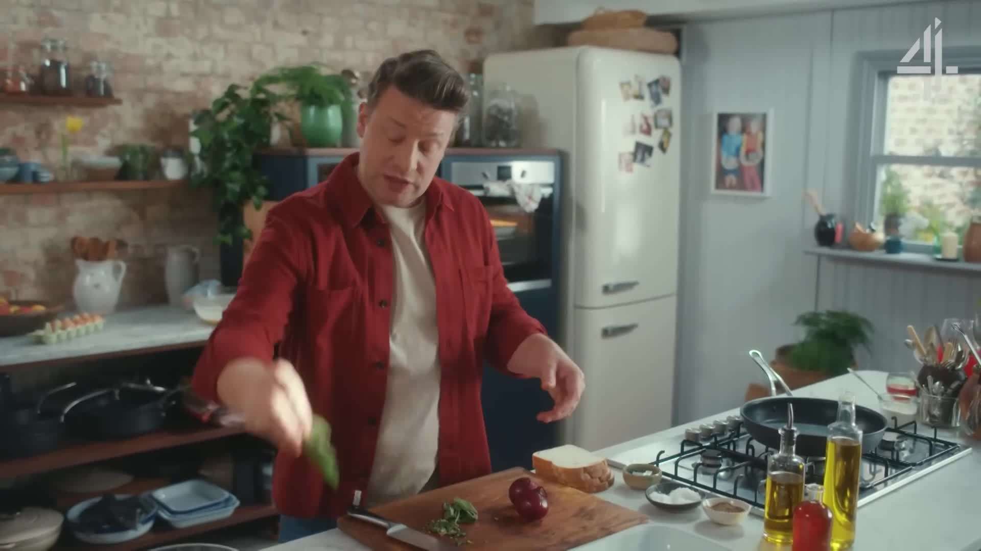 A close-up shot of the Giant Veggie Yorkshire Pudding topped with grated cheese, ready to be baked