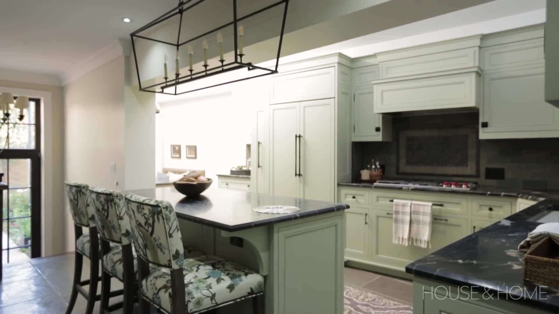 A skilled tradesperson installing custom cabinets in a high-budget kitchen renovation.