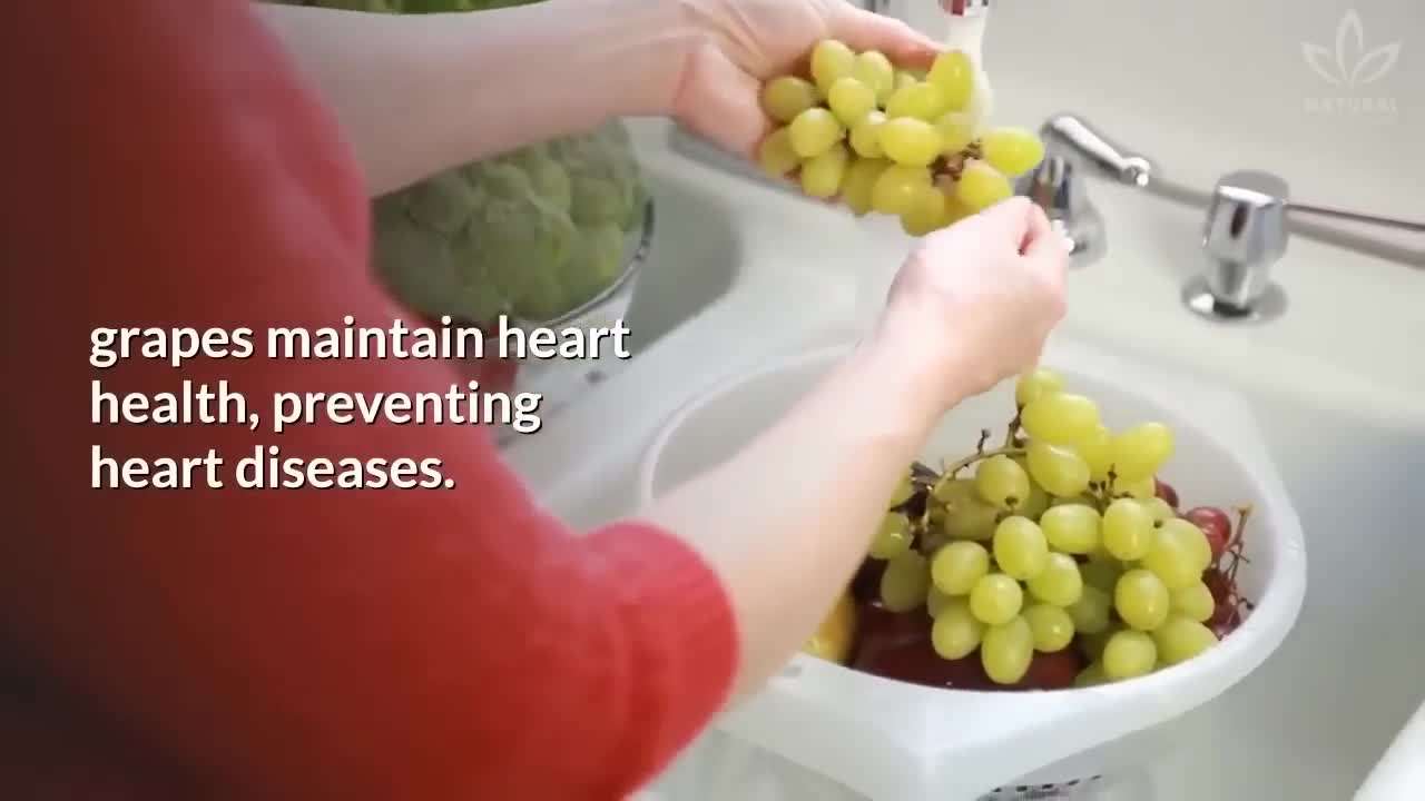 A variety of colorful apples displayed on a wooden table