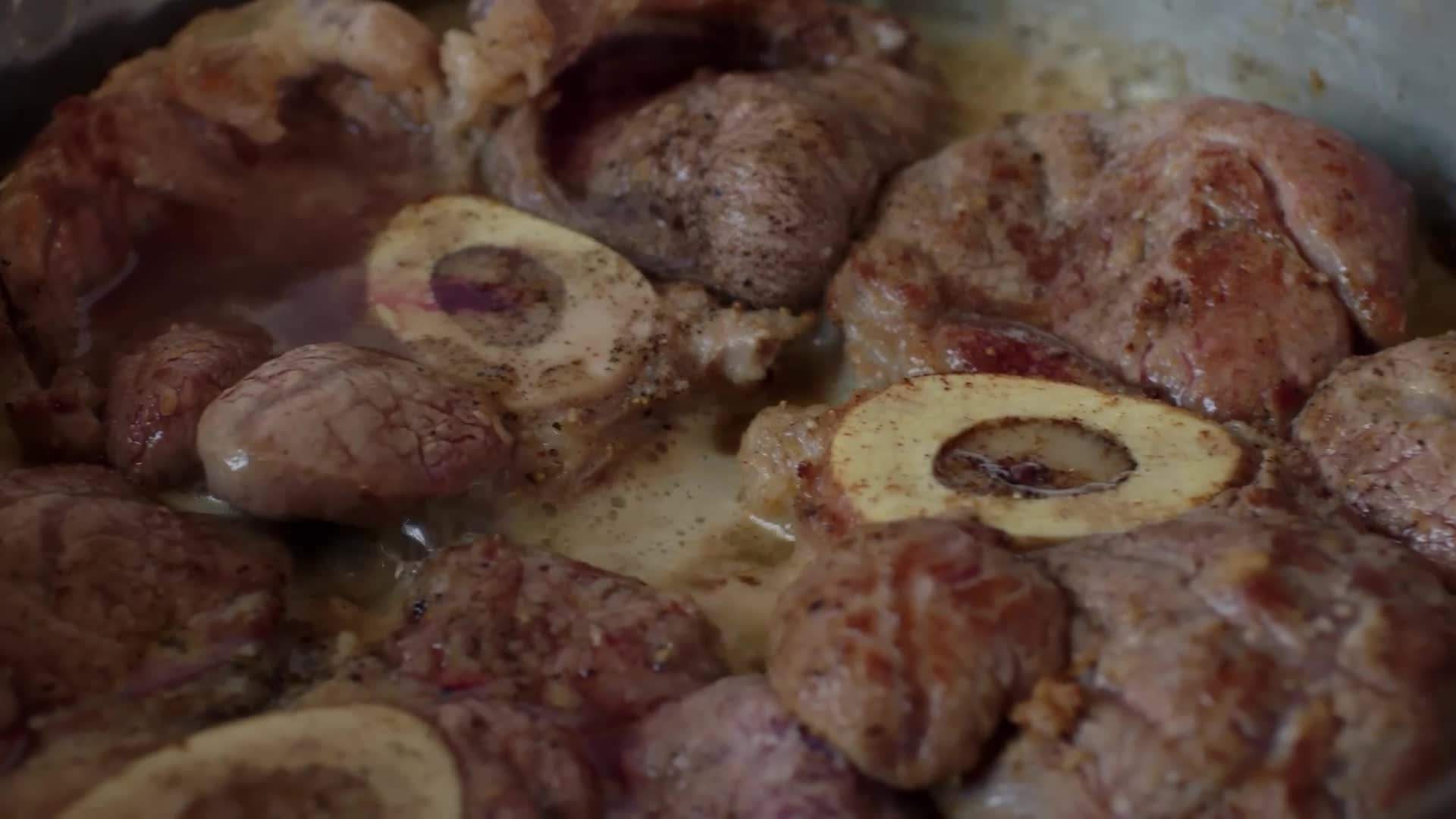 A bottle of white wine, symbolizing one of the key ingredients in the ossobuco recipe