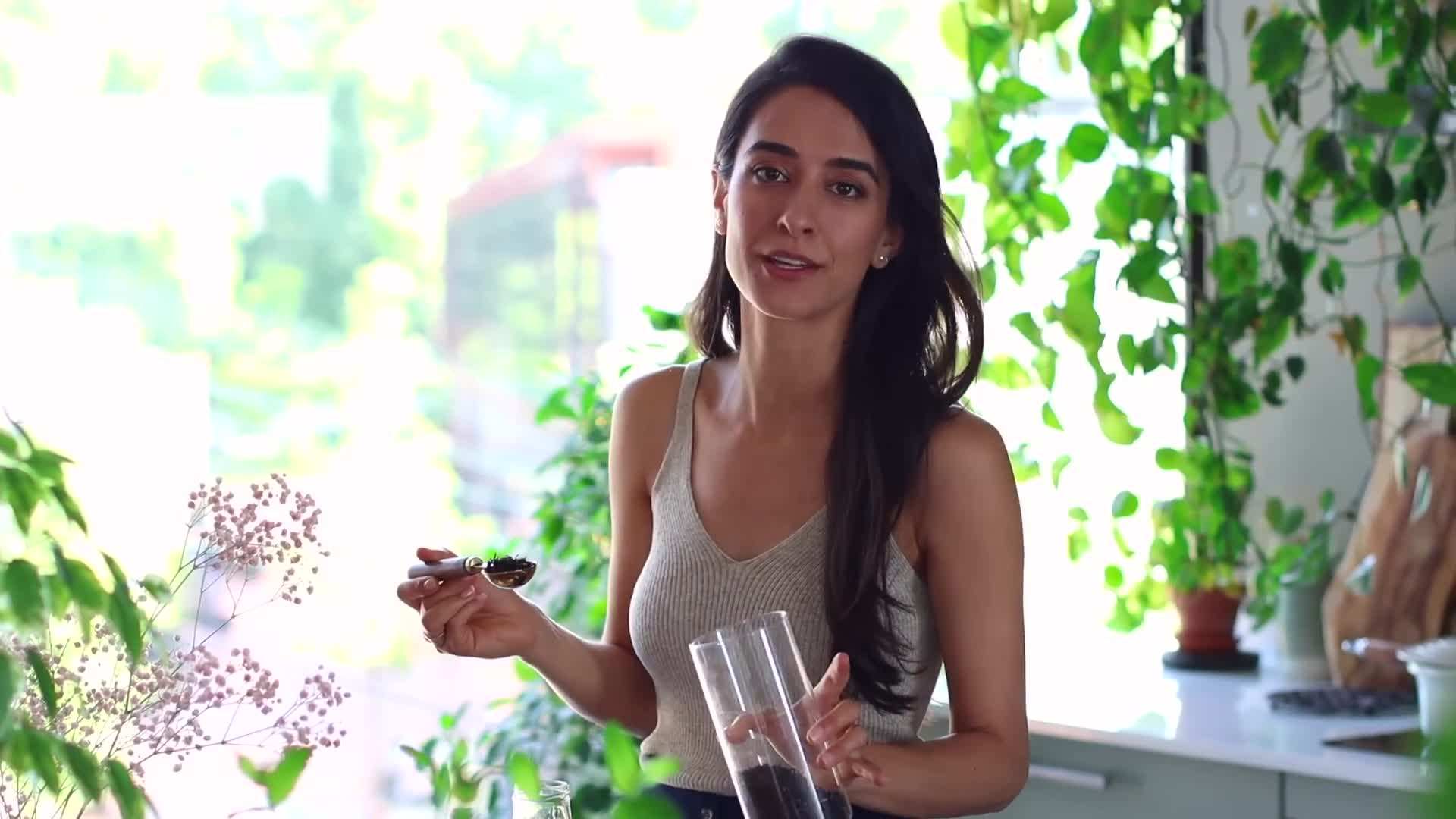 Combining black tea, milk, sweetener, and ice cubes