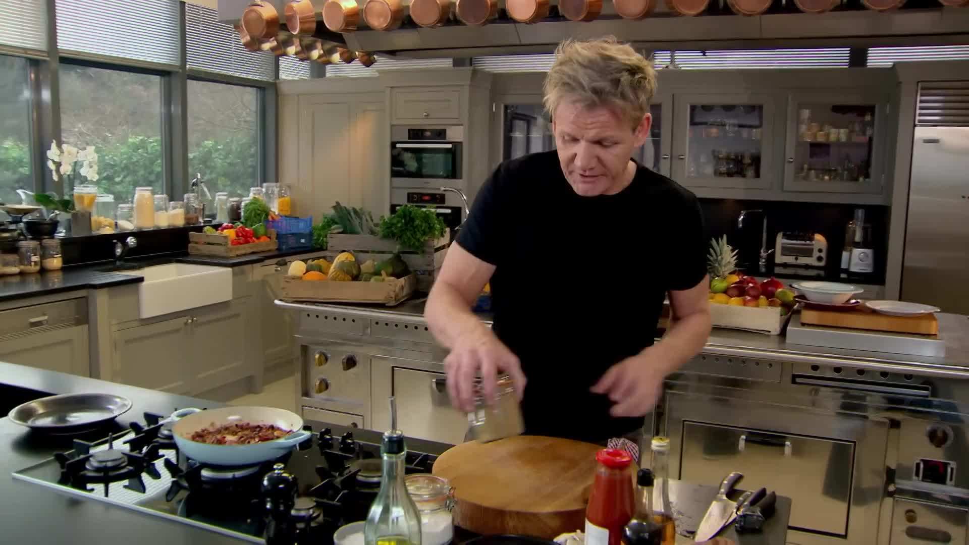 Stacked fluffy pancakes with a colorful assortment of mixed berries