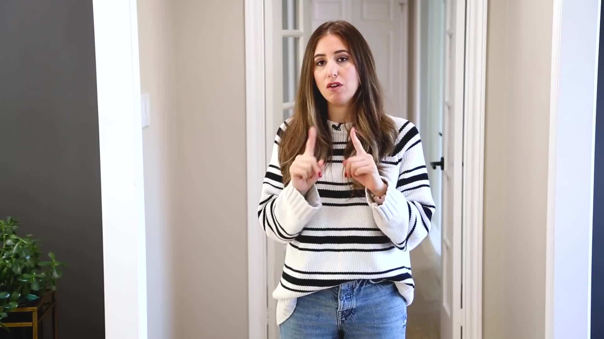 Using a microfiber cloth to dust a television screen