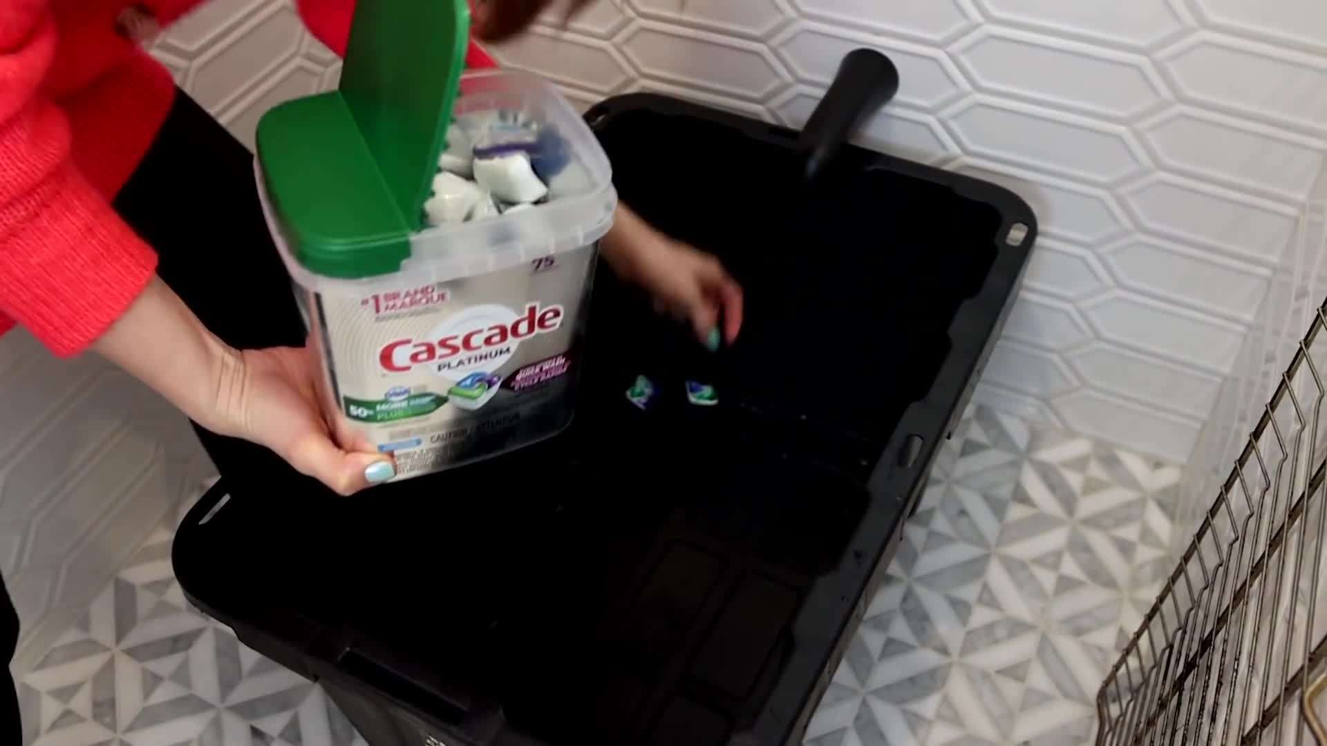 Oven racks soaking in the soapy water