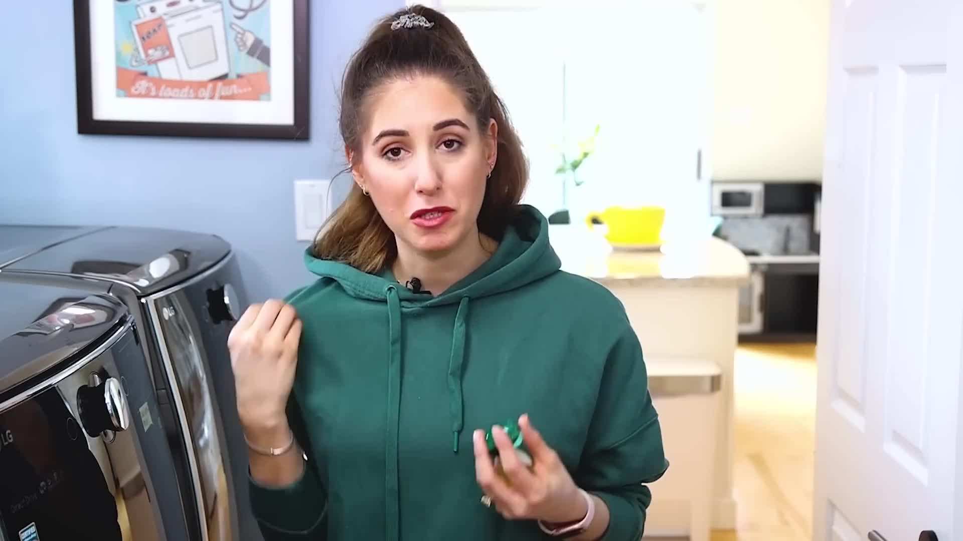 A laundry pod dissolving in water during the wash cycle