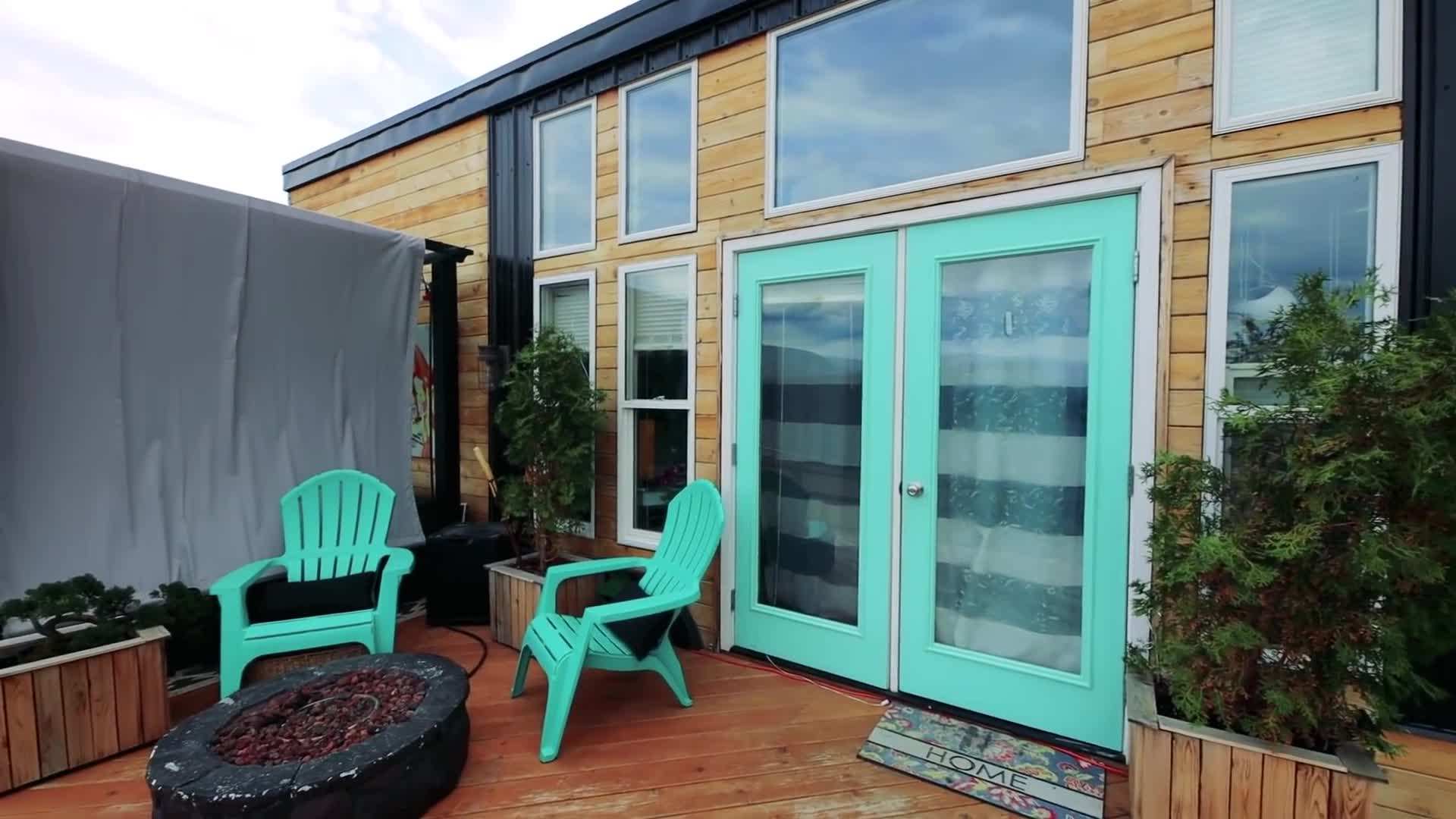 Mother and daughter embracing the freedom of living in a tiny house