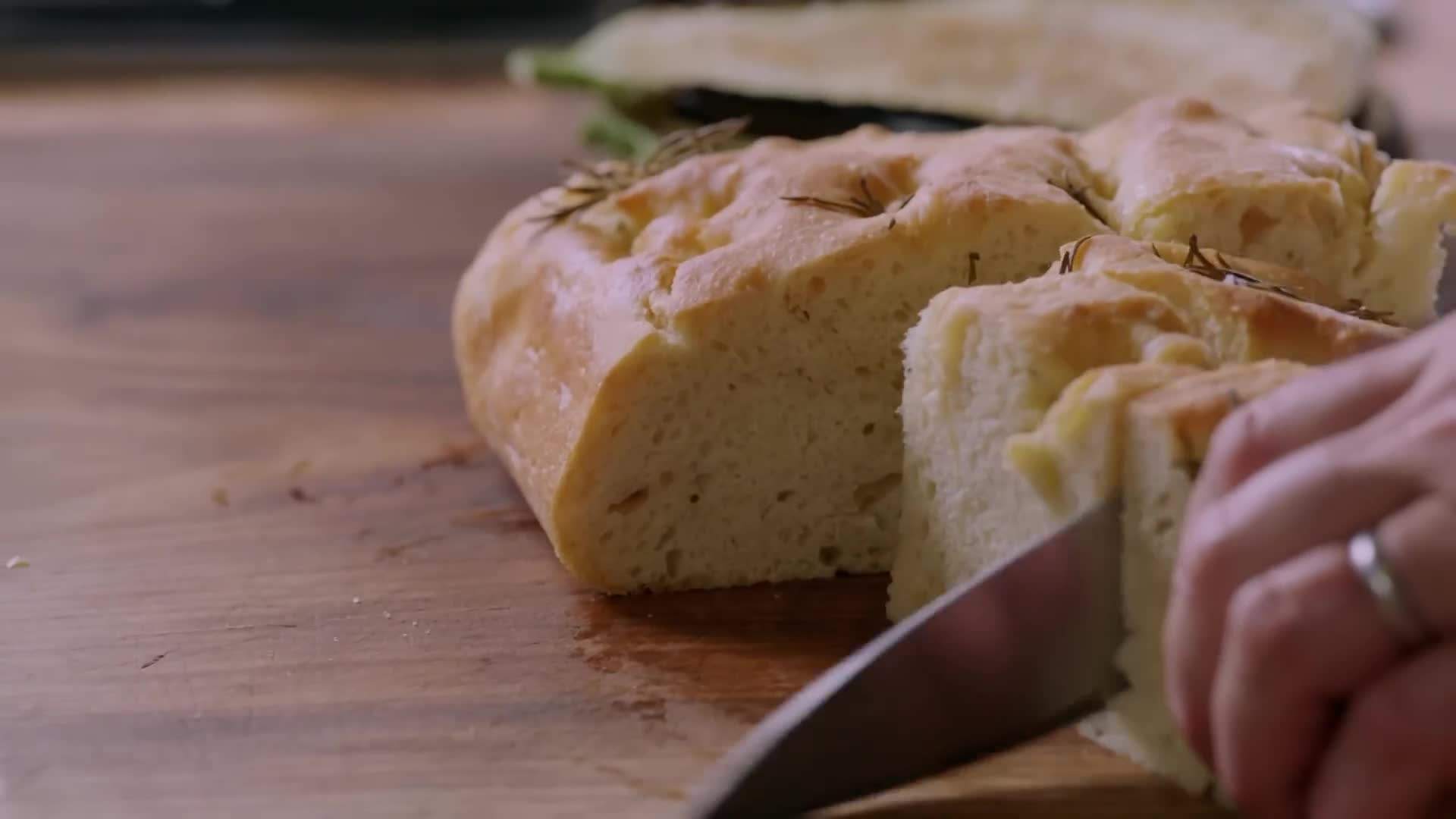 Crispy breaded aubergine slices frying in a pan