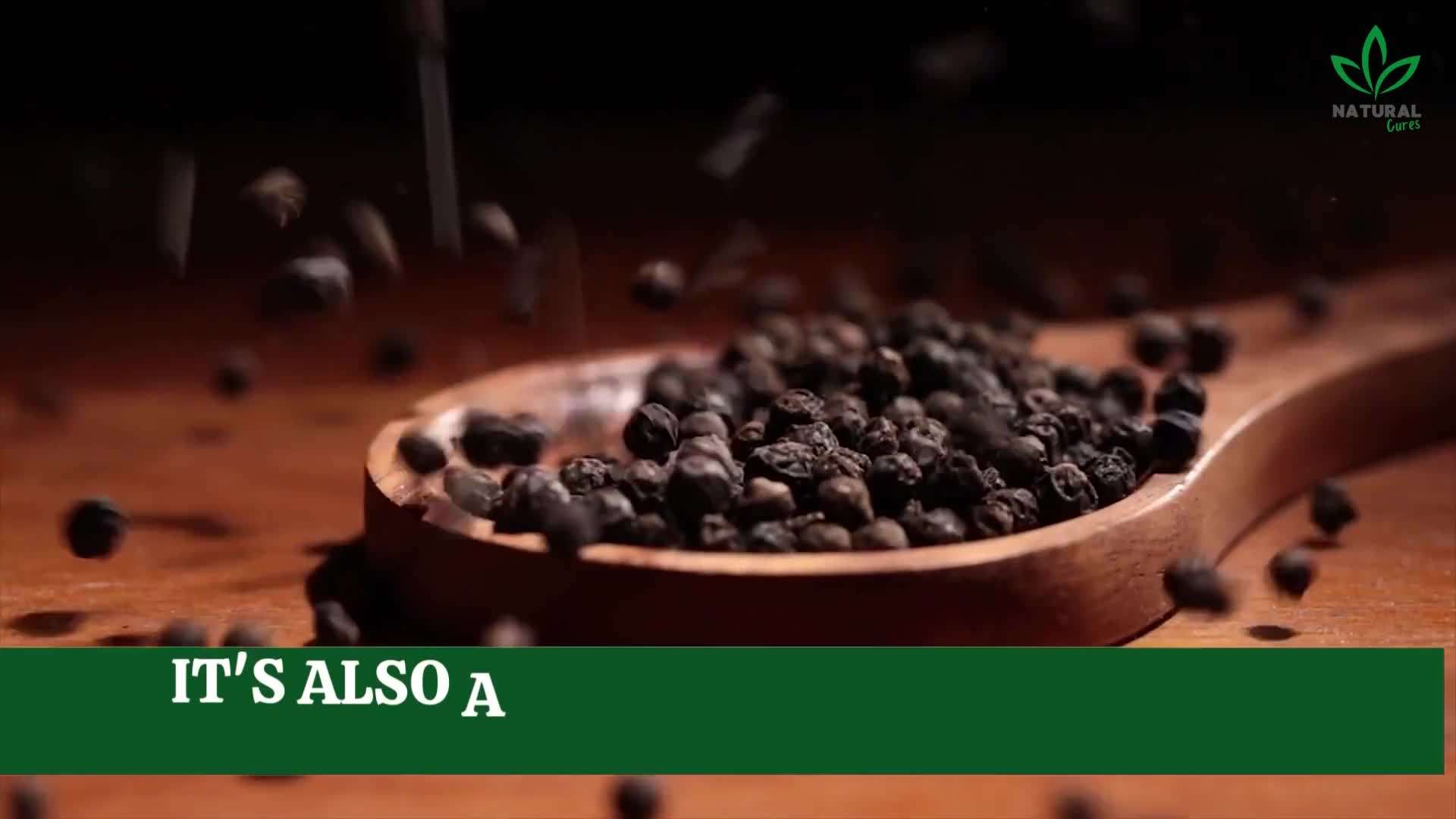 A close-up of black pepper in a spice jar
