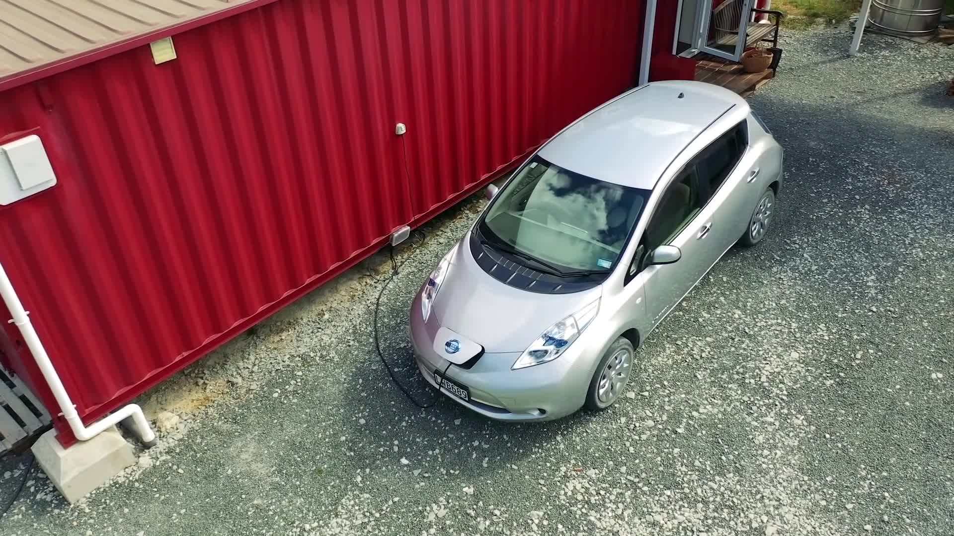 Container home with a green roof and vertical garden