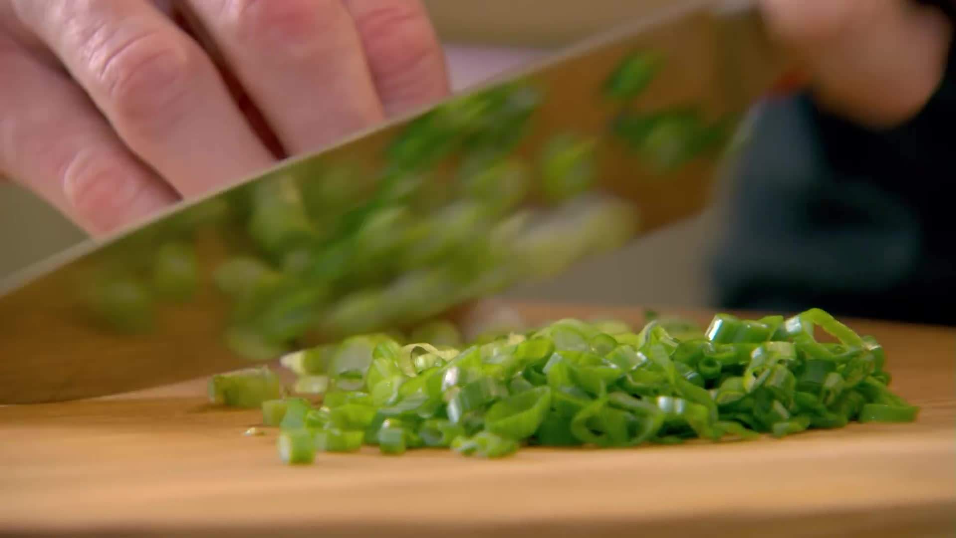 A stack of fluffy pancakes drizzled with maple syrup