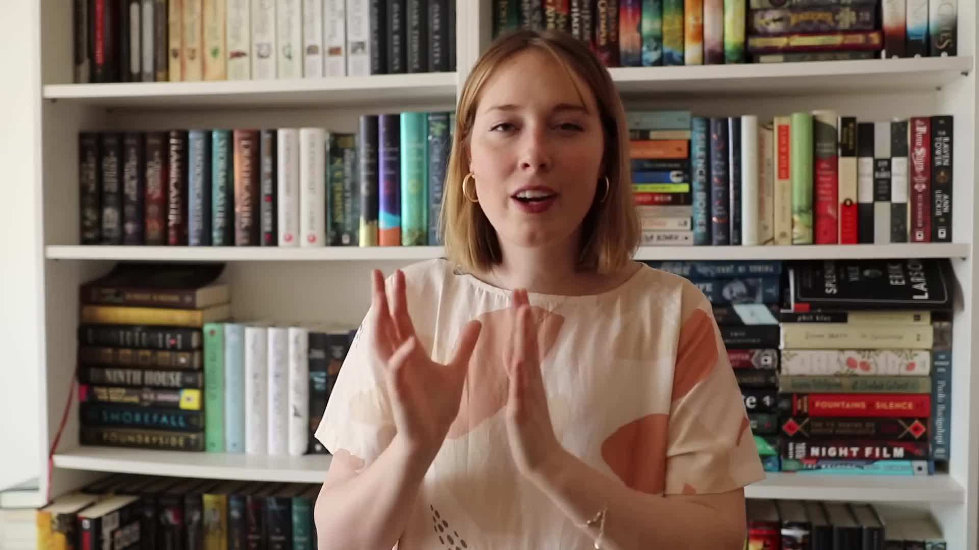 Bookshelf adorned with personalized bookends and decorative items