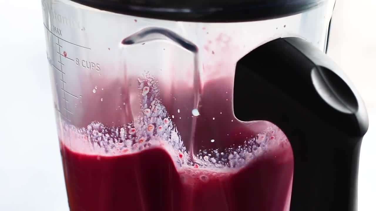 Different flavors of hot chocolate in colorful mugs