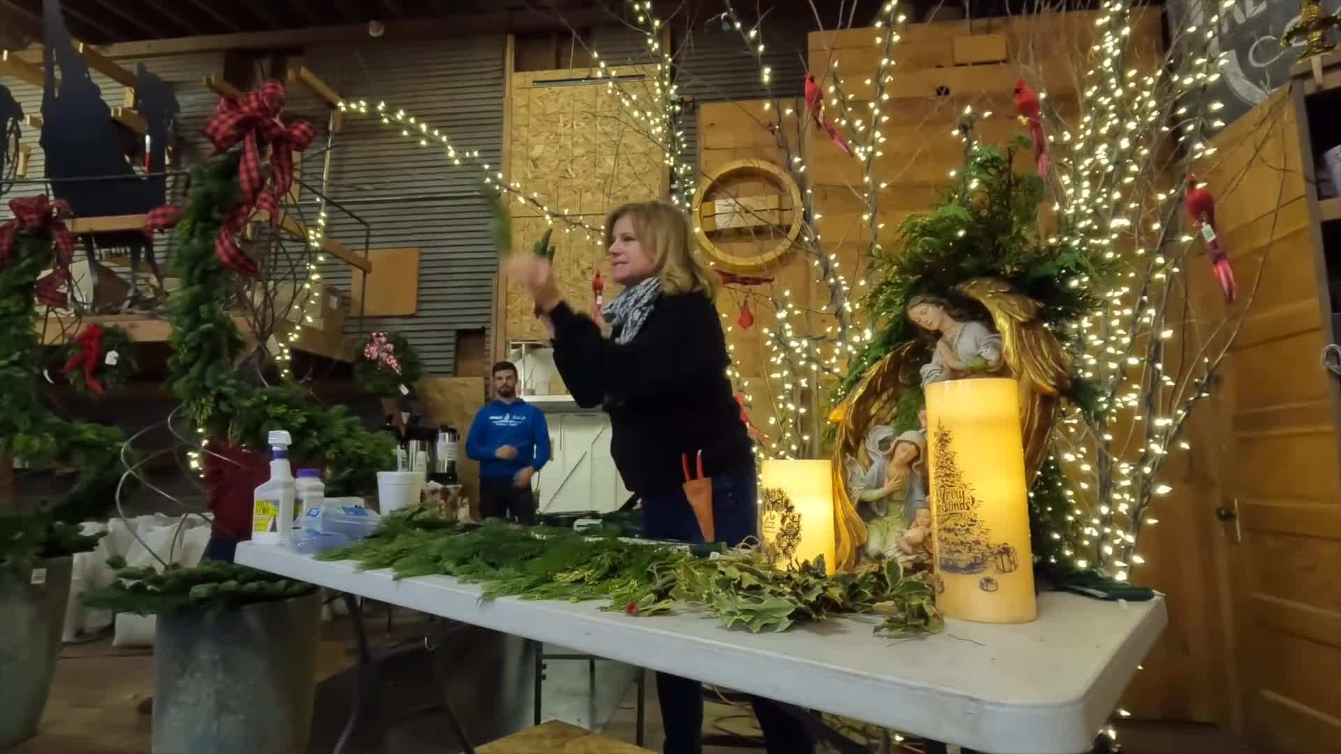 Hanging the wreaths on the great room doors