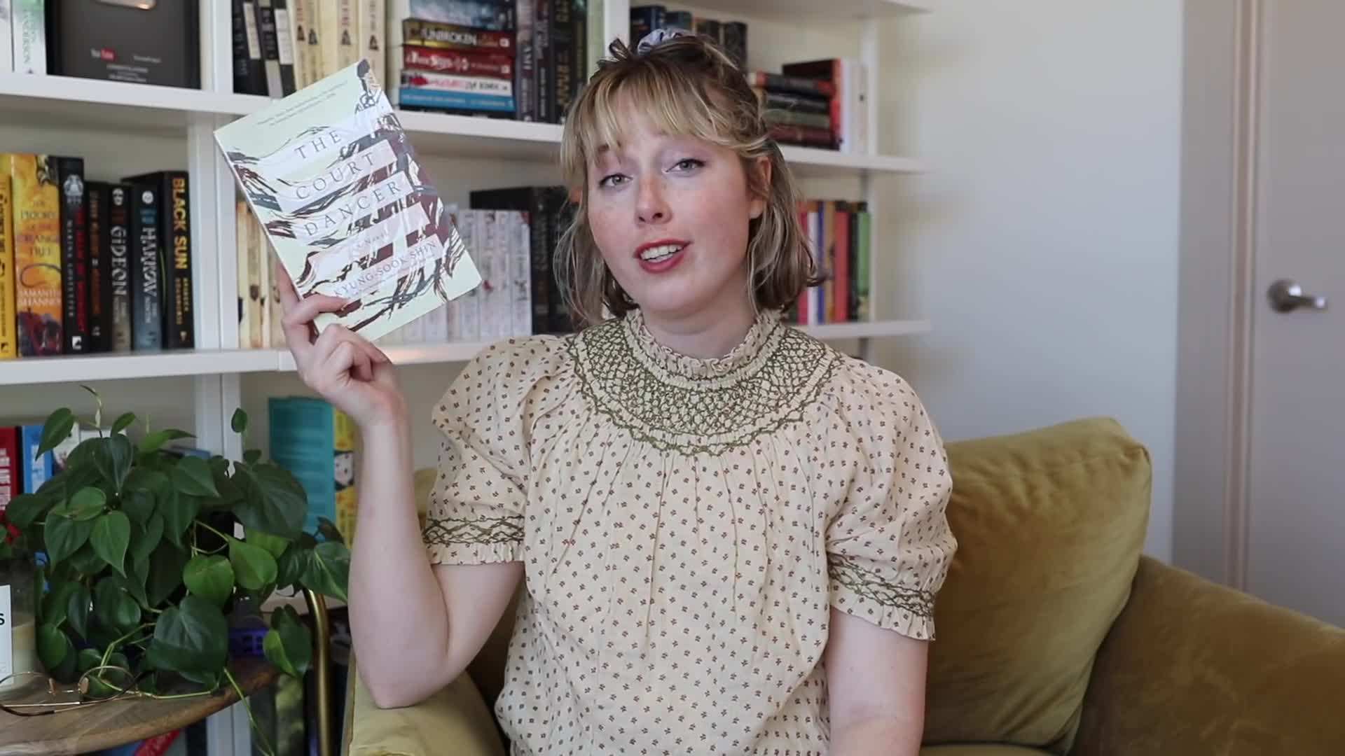 A stack of fantasy books waiting to be read