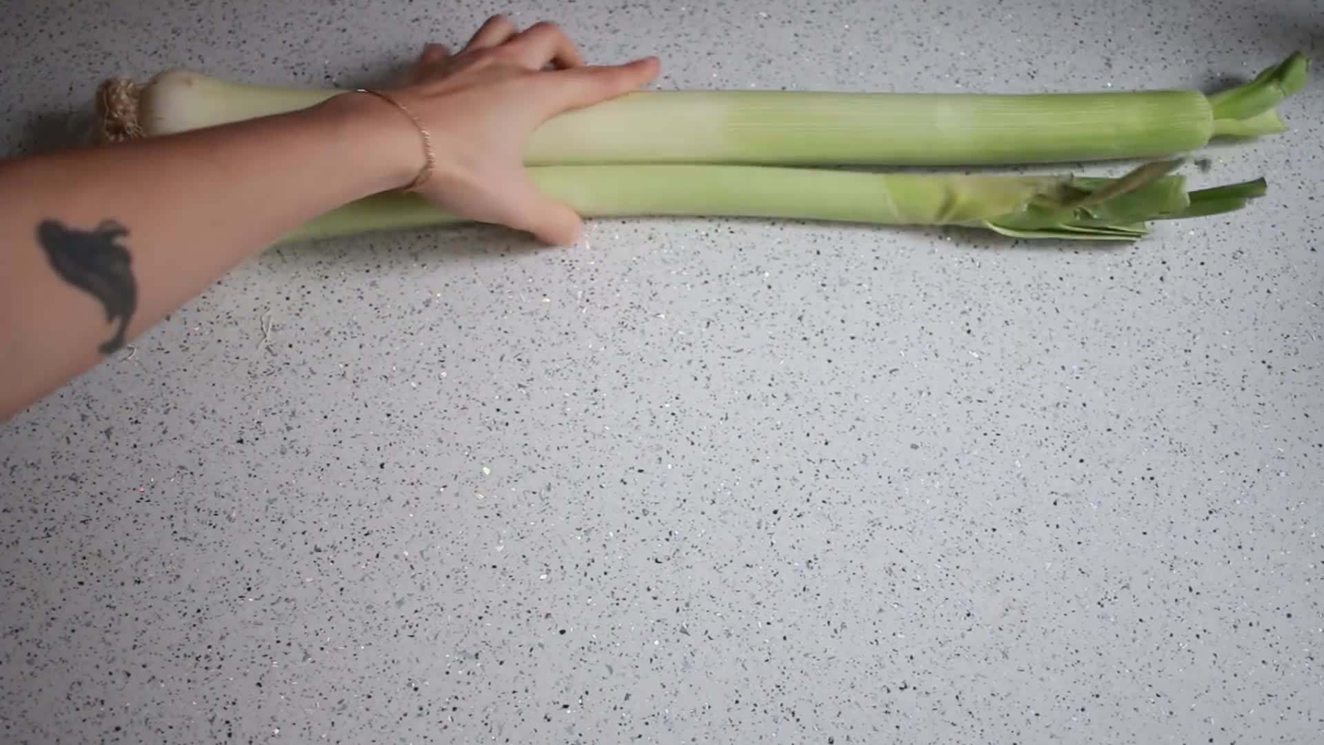 A photo of a reusable bag filled with fresh produce from a farmers' market