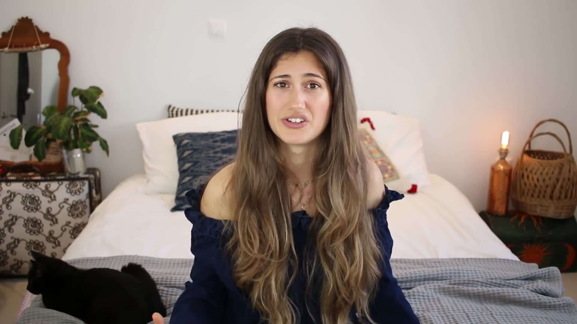 Kristen showcases a variety of vegan ingredients and spices in her pantry, emphasizing the importance of having a well-stocked pantry for easy vegan cooking.