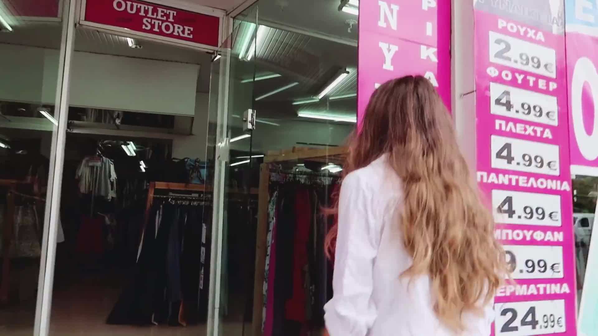 Image of a shopper with a reusable shopping bag at a thrift store