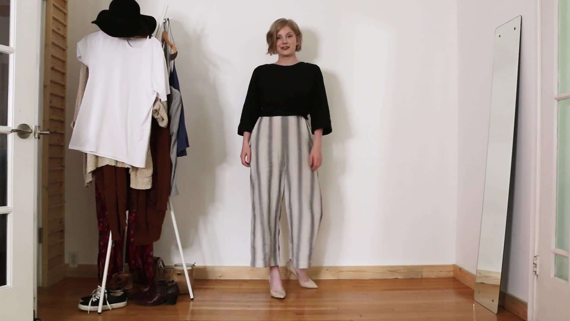 Illustration of a jumpsuit paired with heels and statement jewelry