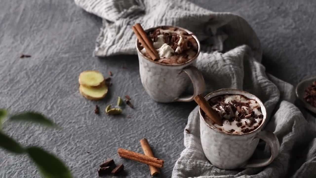 A cup of chamomile tea with chamomile flowers