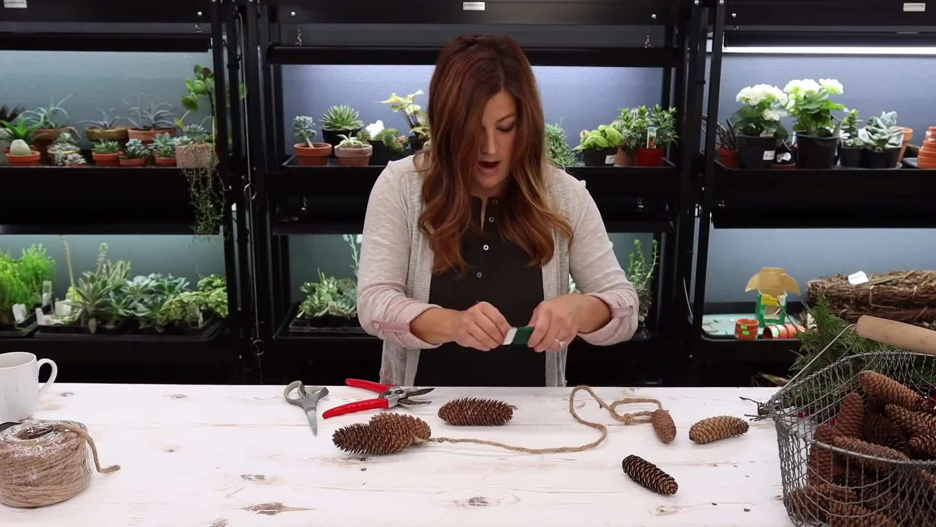 Secure the greenery to the ribbon using floral wire.