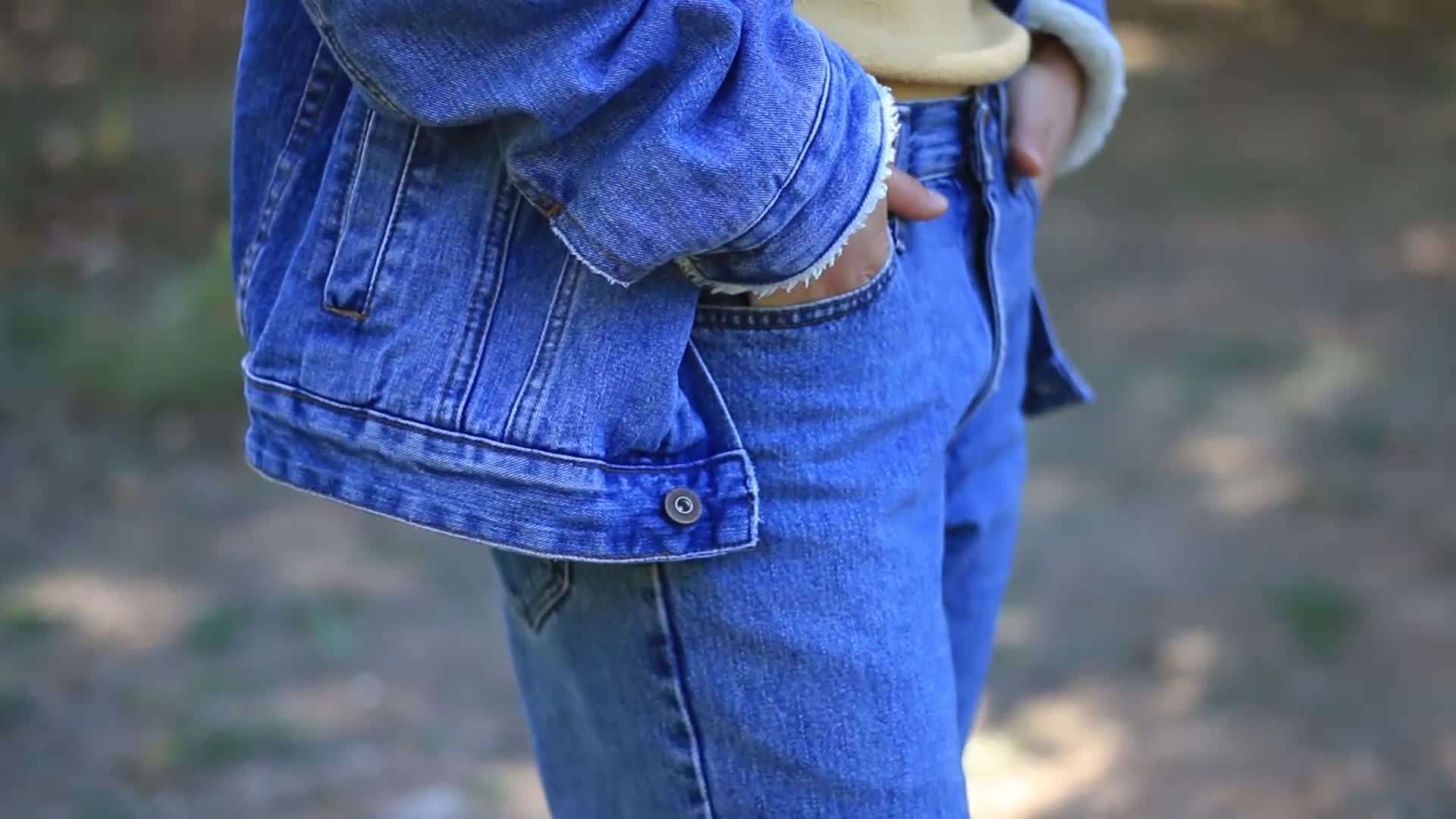 Outfit inspiration: Plaid shirt tied around waist, graphic t-shirt, distressed jeans, and sneakers