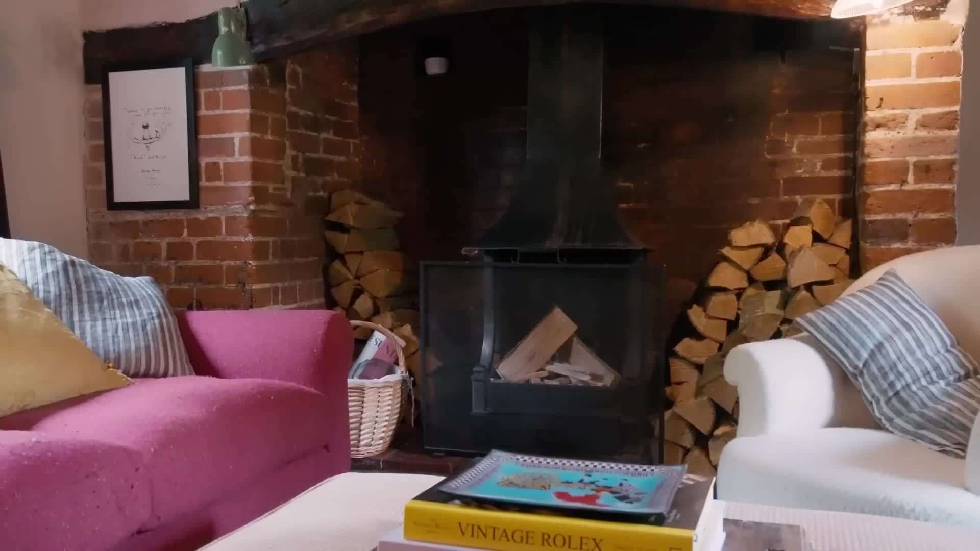 The cozy living room with plush sofas and soft lighting