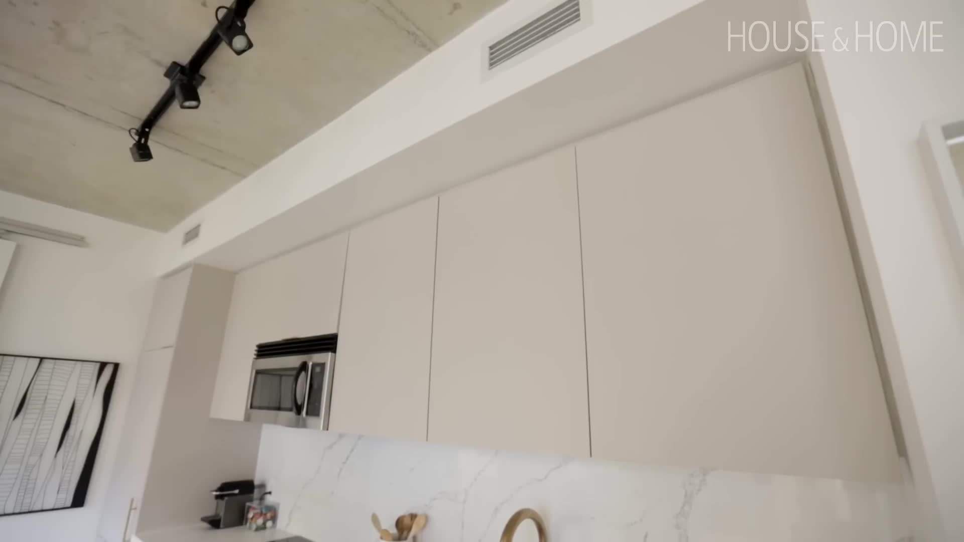 The use of bold colors and sleek lines creates an elegant and edgy look in Isabella's condo