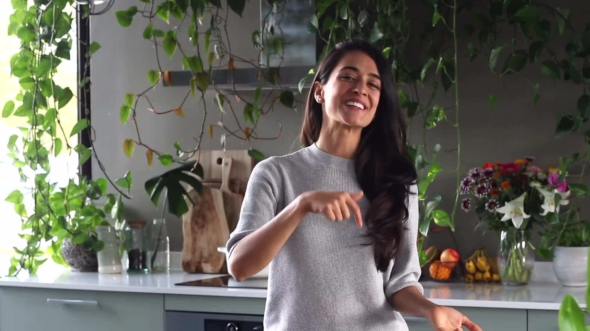 A close-up shot of a bowl of matcha green tea overnight oats with kiwi slices