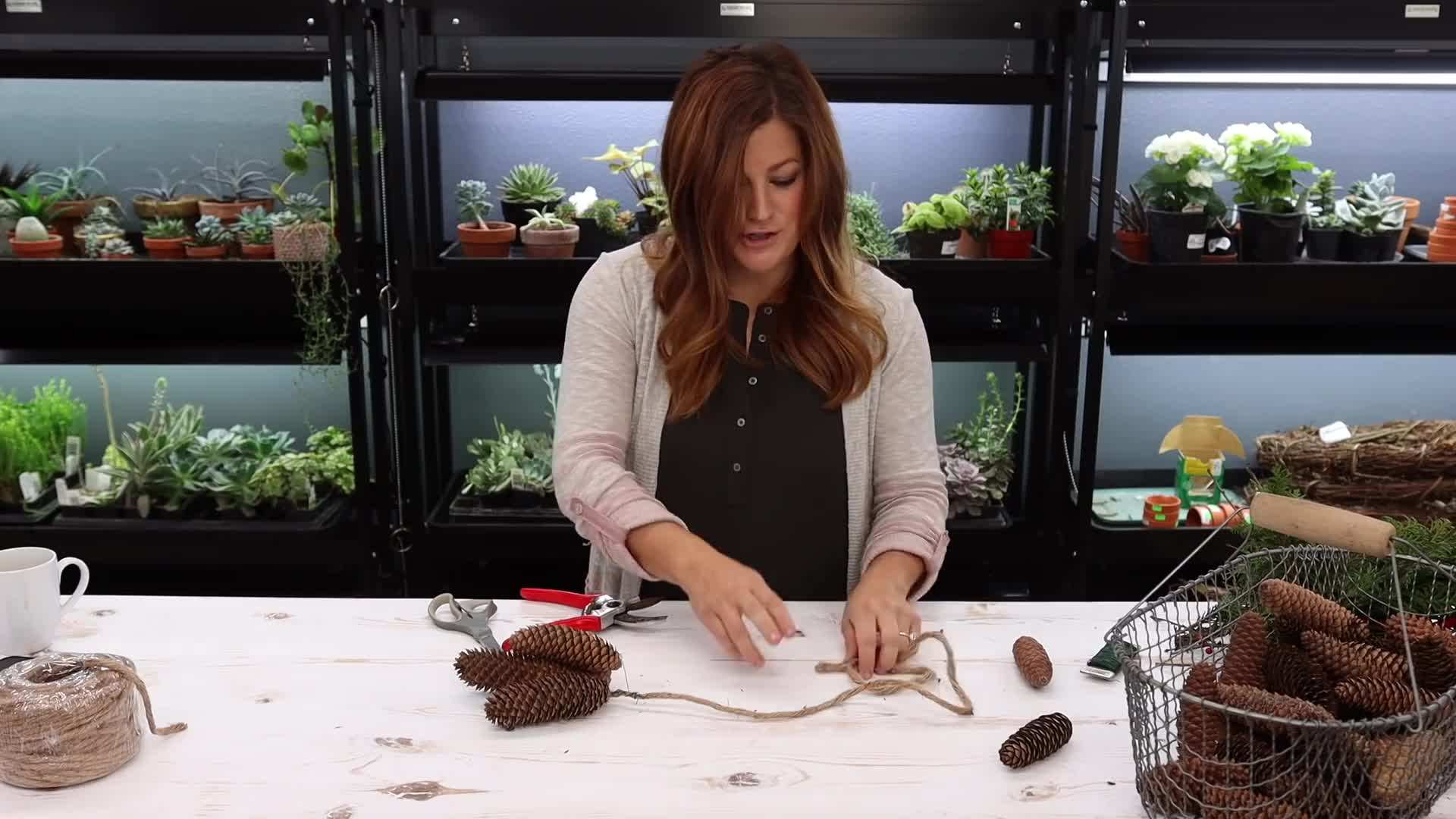 Wire the pinecones onto the swag, spacing them evenly.