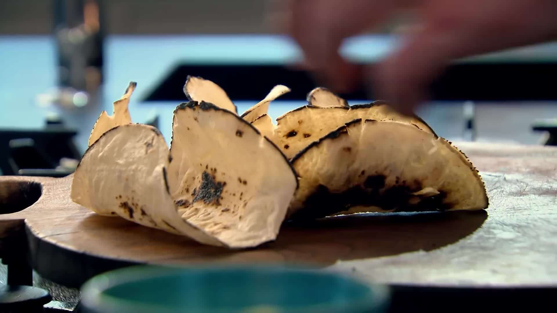 Adding diced tomatoes to the pan