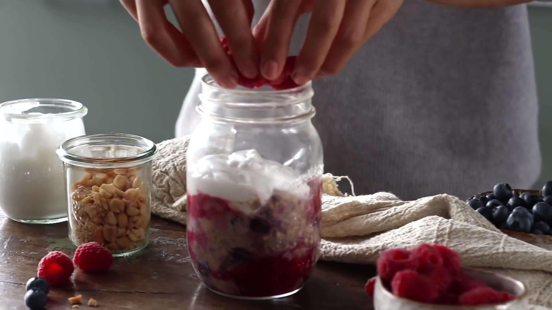 A variety of jars filled with different flavors of overnight oats