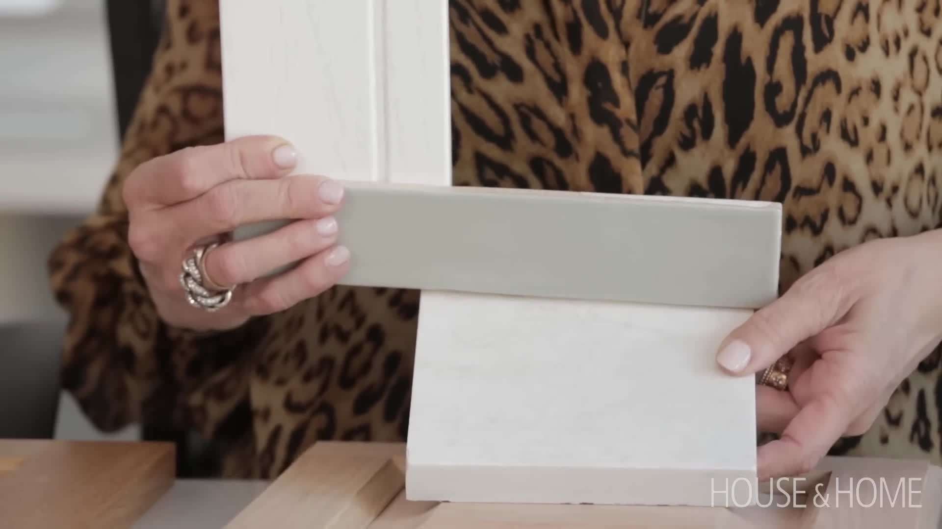 Example of a kitchen with painted cabinets in a trendy color